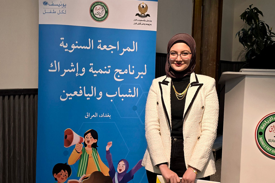 A woman participating at the annual review of Iraq’s youth development program.