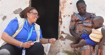 Mawouli Aimée Van-Lare, UN Volunteer Community Health Specialist conducts a follow-up health visit in the village of Youak in the Savanes Region of Togo.