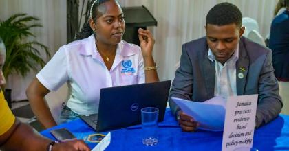 Priyanka Mais (left) UN Volunteer at an event centered on evidence-based decision and policy making in Jamaica.