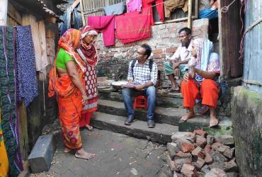 National UN Volunteer Community Organizer Afzal Hossain Sakil with UNDP in Bangladesh assesses the needs of poor communities in Chittagong. 
