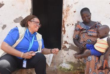 Mawouli Aimée Van-Lare, UN Volunteer Community Health Specialist conducts a follow-up health visit in the village of Youak in the Savanes Region of Togo.