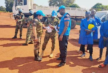 Ahmed Abdillah (front) UN Volunteer Electoral Advisor receives election material for the census in Bria in November.