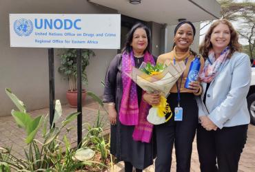 Akola Munyiri posing for a photo with colleagues from UNODC Eastern Africa during her farewell party