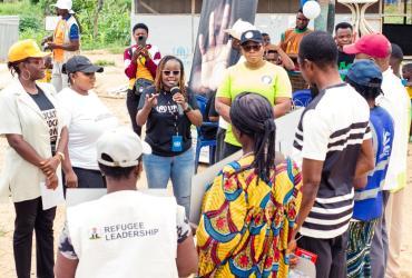 Grace Kironcho (center) UN Volunteer Associate Protection Officer with UNHCR advises the anti-human trafficking committee members in the Ikyogen Settlement on the occasion of World Day Against Trafficking in Persons.