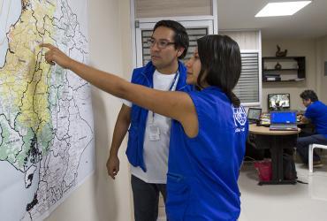 Andrea Cuisana (right), national UN Volunteer Specialist, Project and Camp Management Assistant, and David Barreno, national UN Volunteer Specialist, Procurement and Logistics Assistant, served with IOM in Manta, Ecuador.