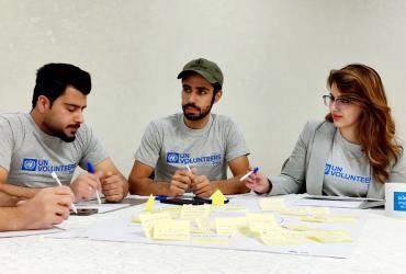 (From left to right) Online volunteers with UNDP Abdullah Amer, Mohammed Salahadin, and Aya Salam attend a workshop run by the Accelerator Lab in Erbil.