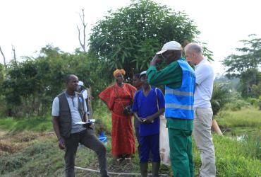 Jean-Martial Konan (right) UN Volunteer Monitoring and Evaluation Specialist at a UNDP mission to the Ayedi fish farm in Zéaglo, Guiglo Department.