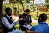 Volunteering builds inroads and supports communities. In this photo, UN Volunteers interview community members to assess their basic health services in rural parts of Rwanda.