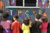 Youth painting a mural to raise awareness of COVID-19 in Vuniivi settlement Lami, Fiji.