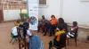 Farisai (in orange t-shirt) during a mentorship session on tackling Gender-Based Violence (GBV) in Mozambique