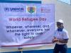 Jestina Simba, Volontaire des Nations Unies, chargée de programme associée, sert le HCR. On la voit ici lors de la commémoration de la Journée mondiale des réfugiés 2022.