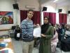 International UN Volunteer Mikael Maerker (fully funded by the Government of Sweden) handing out certificates at the end of a CV-writing workshop for UNRWA volunteers.