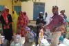 UN Volunteer Newton Mutunga distributing items on IVD.