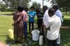 UN Volunteer Hodaka Kosugi provided technical support to health workers to disinfect water using chlorine solutions for Ebola infection prevention and control in Ntroko District, Uganda.
