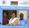 Shukria Syed, UN Volunteer with UN Women, poses with women from South Sudan during International Women's Day event