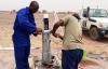 UN Volunteer Clifton Shimenga building a water pump in Western Sahara.