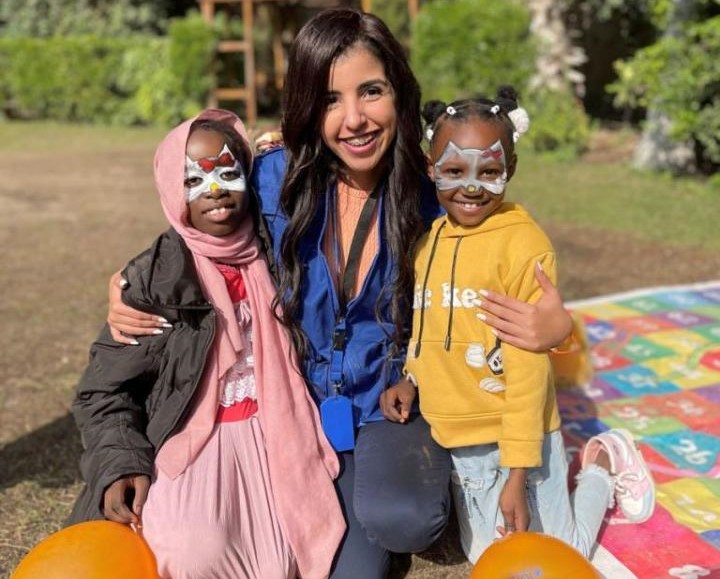 UN Volunteer Yasmine Hassan (centre) during an activity for children held on the occasion of the International Day for the Elimination of Violence against Women in Cairo, December 2022.