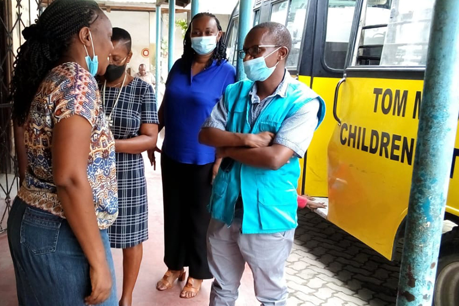 Nahashon Njuguna (front left), national UN Volunteer Social Protection Officer with UNICEF, visits the Tom Mboya School for Cerebral Palsy in Kenya.