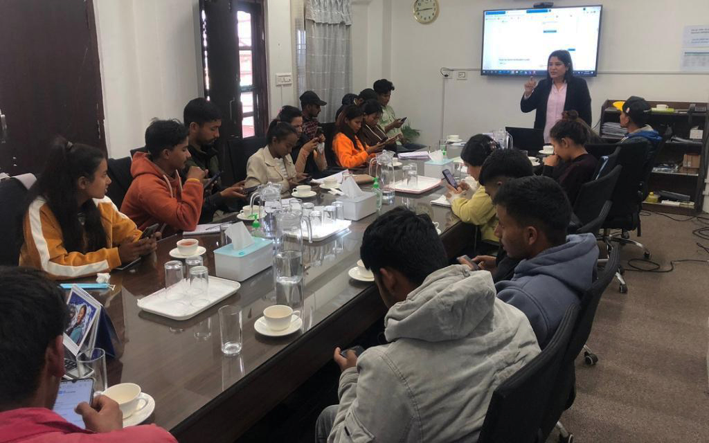 Rina Pradhan (standing far right), national UN Volunteer Programme Assistant with UNV engages the youth from Surkhet, Karnali province on becoming a UN Volunteer.